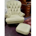 A Victorian style deep button back butterscotch coloured leather armchair and conforming