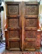 A pair of Middle Eastern carved door possibly Berber, each door being made from a single piece and