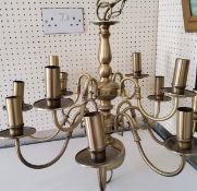 A brass ceiling light, two tiers of eight and four lights, scroll arms, 20th century
