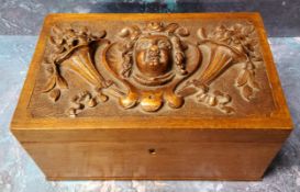 A 19th century walnut rectangular box, the cover in relief with mask and cornucopias, 20cm wide, c.