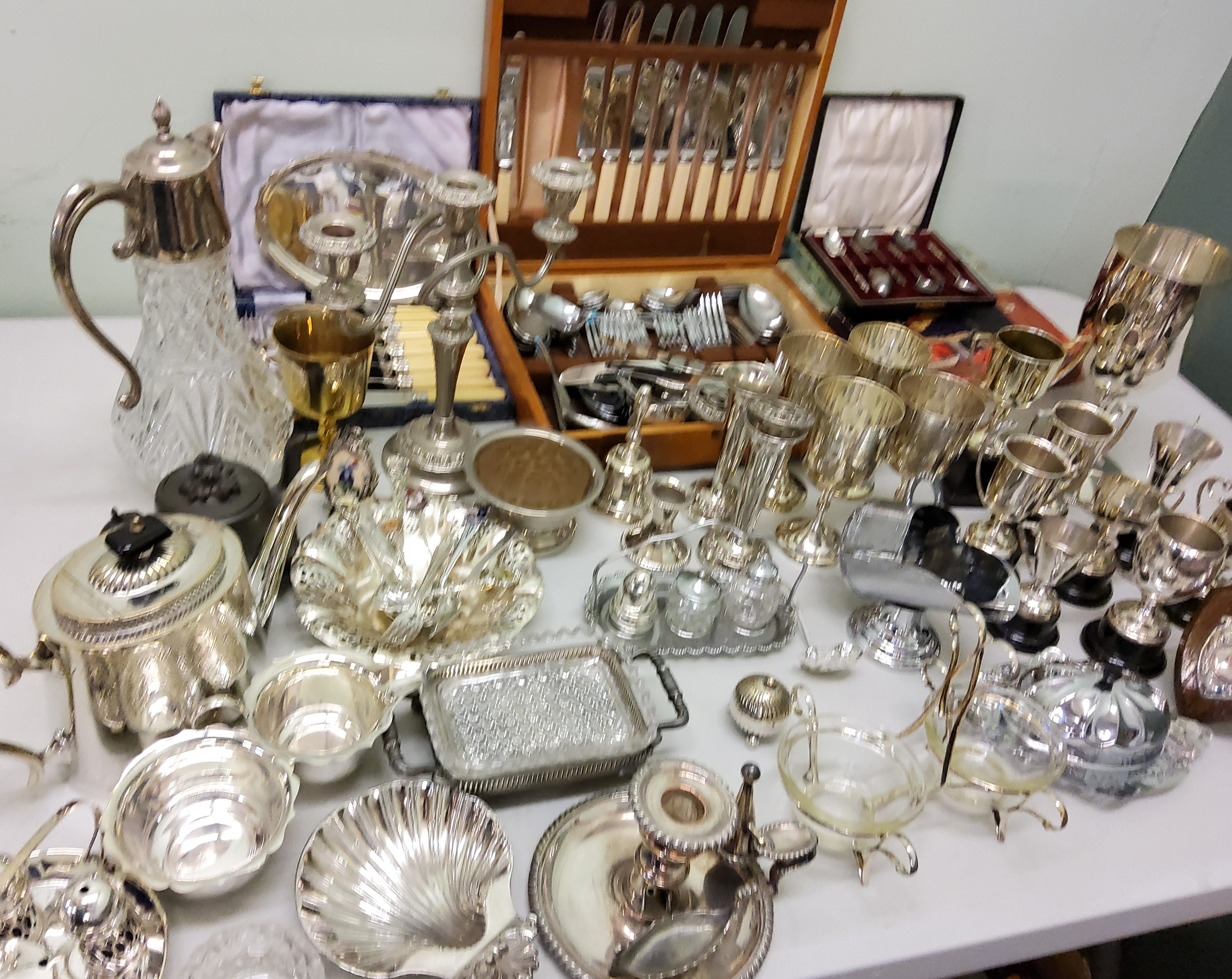 Plated Ware - trophies;  goblets;  flatware;  teapot;  claret jug;  Sheffield plated chamber stick;