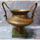 A 19th century Grand Tour bronze mantel urn, cast with stylised foliage, high handles, square