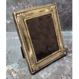 A silver rectangular easel photograph frame, anthemion to angles, 12cm x 10cm, Sheffield 1996