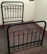 A Victorian cast iron double bed frame, picked out in gilt, with supports