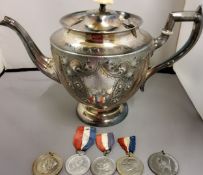 A late 19th century E.P.B.M. pedestal teapot, embossed with flutes and foliate scrolls, bine