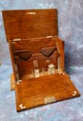 A Victorian oak table top stationery box, the interior with inkwell, waterfall letter rack,