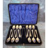 An Edwardian cased set of twelve silver teaspoons & sugar nips, Hammond, Creake & Co, Sheffield 1906
