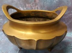 A Chinese bronze censer, lobed, tripod feet, 14cm wide, seal mark