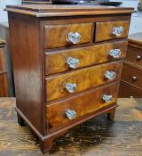 A Victorian mahogany apprentice piece, miniature chest of two short and two long drawers, glass