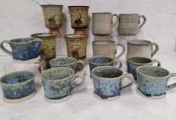 A set of six Studio Pottery mugs, cream jug and sugar bowl, glazed in crystallised blue, 5.5cm high,