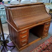 An early 20th century oak American tambour fronted roll top bureau / Derby desk by Thomas Turner c.