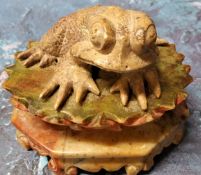 A 19th century Chinese soapstone model, of a toad, seated on a lotus, 5.5cm high