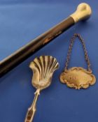 A Victorian silver caddy spoon, shell shaped bowl, Birmingham 1864;  a plated decanter label, Hock;
