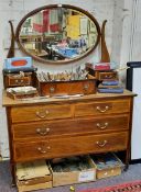 An Edwardian mahogany dressing table, oval mirror, above two short and two long drawers, tapering
