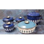 Three graduated Catherine Holm of Norway Blue Lotus pattern  saucepans and covers;  a similar