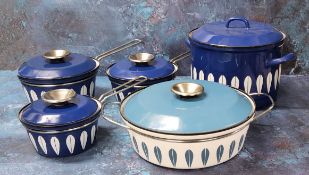 Three graduated Catherine Holm of Norway Blue Lotus pattern  saucepans and covers;  a similar