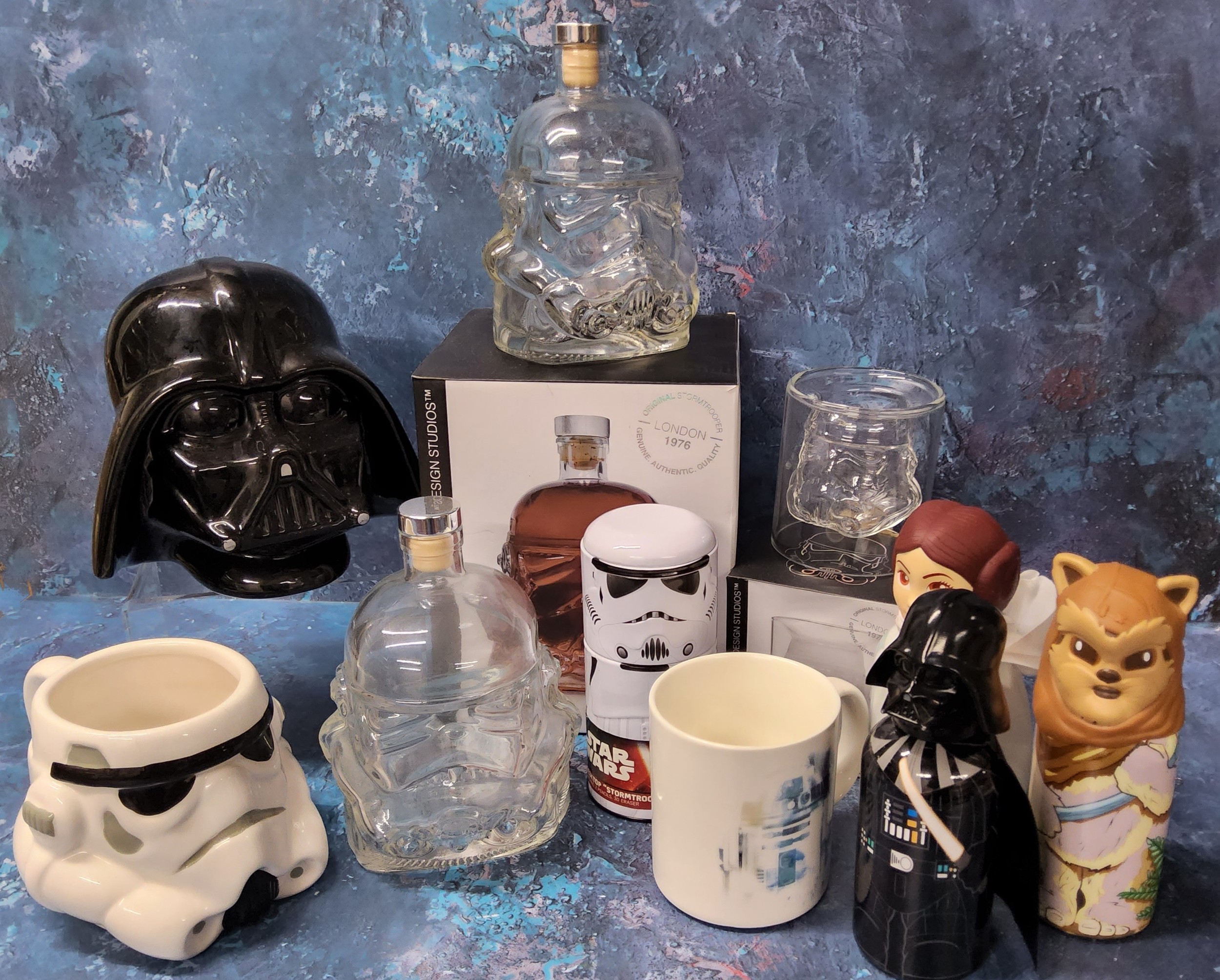 A Shepperton Design Studios Stormtrooper glass decanter in original packaging; another loose; a