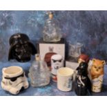 A Shepperton Design Studios Stormtrooper glass decanter in original packaging; another loose; a