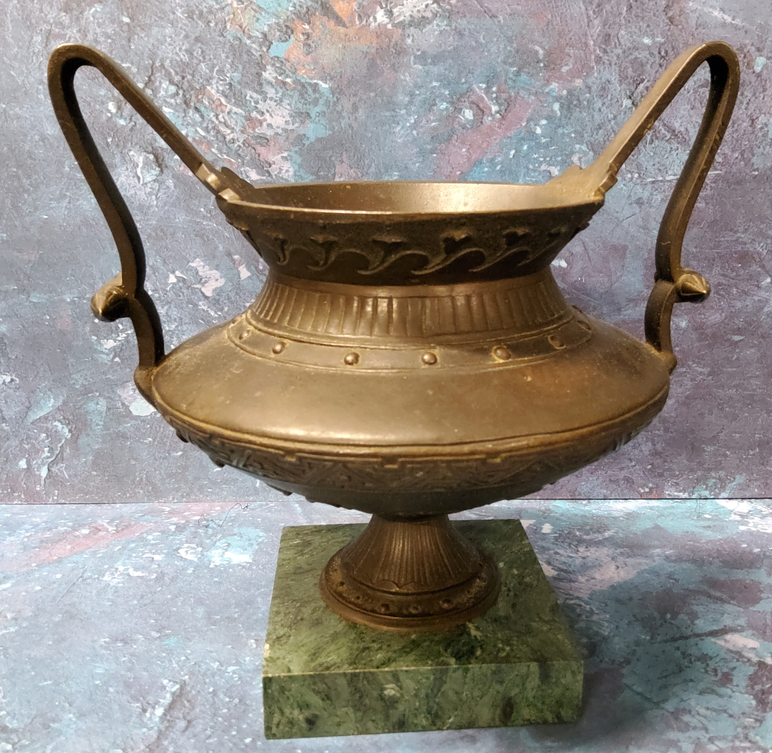 A 19th century Grand Tour bronze mantel urn, cast with stylised foliage, high handles, square - Image 2 of 2