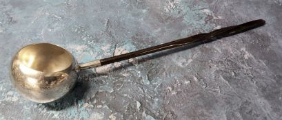 A 19th century Scottish silver plated toddy ladle, wrythen handle, the globular bowl engraved,