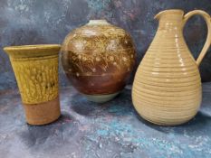 A Studio Pottery globular vase, incised with bands of stylised flowers on a mottled brown ground,