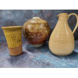 A Studio Pottery globular vase, incised with bands of stylised flowers on a mottled brown ground,