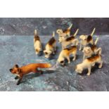 Eight Beswick fox hounds, various poses;  a Beswick fox (9)