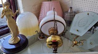 An brass  oil lamp style ceiling lamp;   a Florence figural side light;  other light fittings