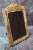 A silver arched rectangular easel photograph frame, embossed with ribbon tied husk swags,  24cm x