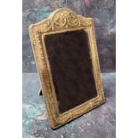 A silver arched rectangular easel photograph frame, embossed with ribbon tied husk swags,  24cm x