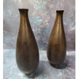 A pair of Japanese bronze ovoid vases, engraved with leaves, 23.5cm high, Meiji period