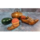 A 20th century treen novelty pin cushion, in the form of clog, thimble aperture, 13cm wide; a