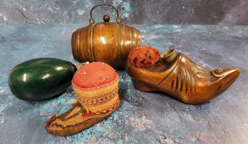 A 20th century treen novelty pin cushion, in the form of clog, thimble aperture, 13cm wide; a