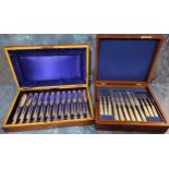 A set of twelve E.P.N.S. fish knives and forks, engraved and chased, mahogany case; a set of