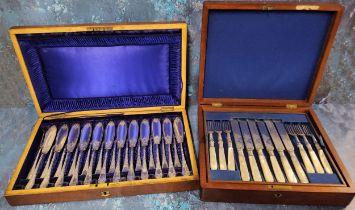 A set of twelve E.P.N.S. fish knives and forks, engraved and chased, mahogany case; a set of