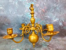 An 18th century Dutch style brass four light ceiling candle holder, 28cm high