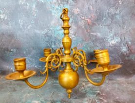 An 18th century Dutch style brass four light ceiling candle holder, 28cm high