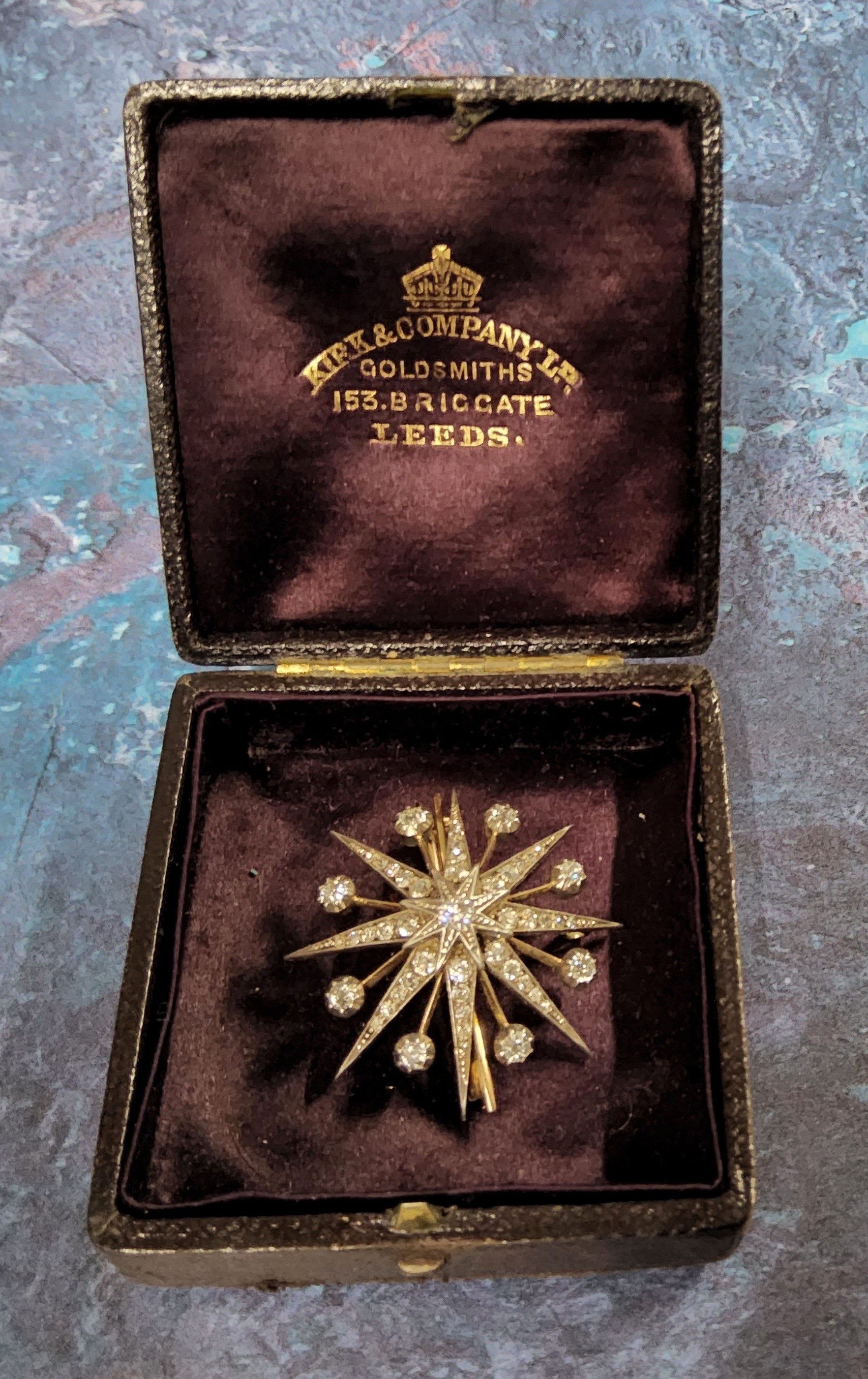 A Victorian yellow & white metal diamond star brooch/pendant, eight round old cut diamonds collet