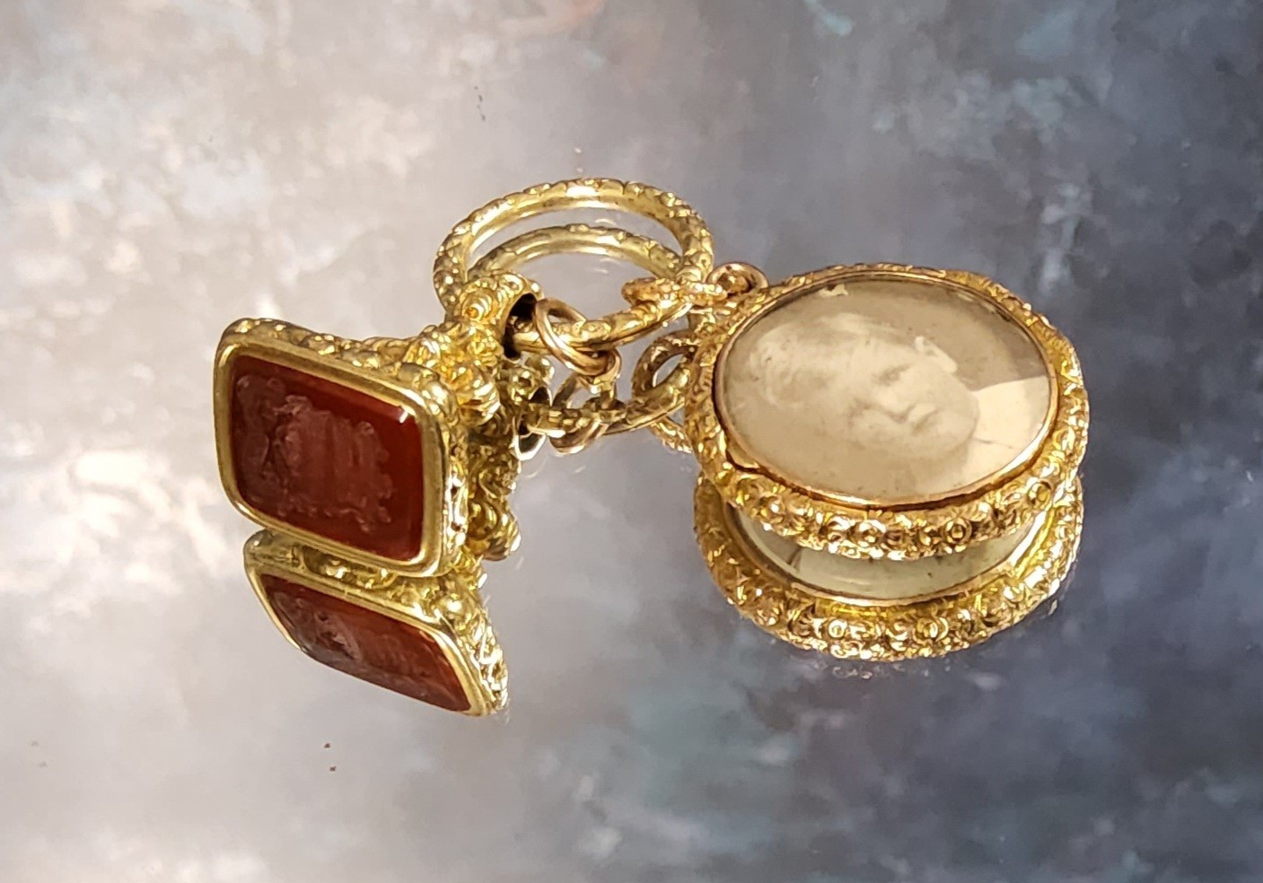 A Victorian yellow metal fob seal, the cornelian debosses with a crest and motto; 9ct gold open-face - Image 2 of 2