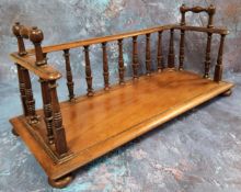 A George IV mahogany book carrier, turned spindles, rectangular base, bun feet, 41cm wide, c.1825