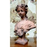 French School, early 20th century, a signed terracotta bust, of a young lady with floral chaplet,