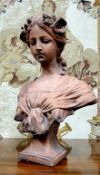 French School, early 20th century, a signed terracotta bust, of a young lady with floral chaplet,