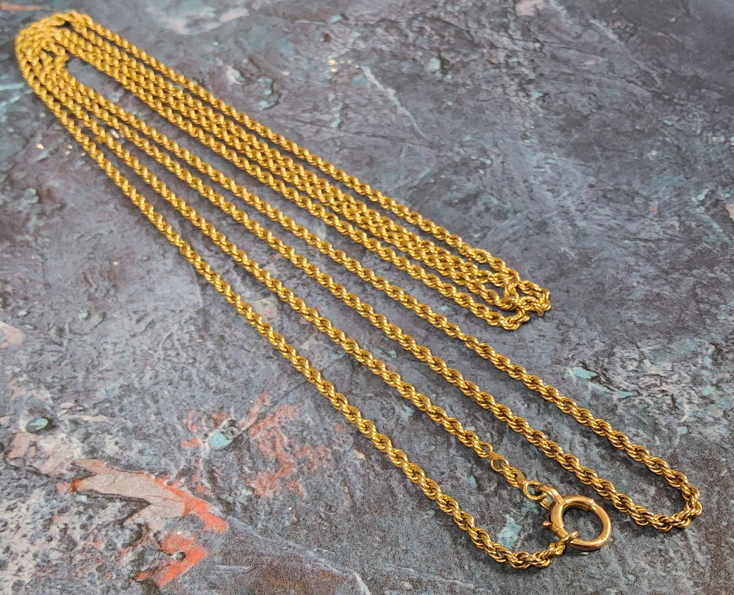 A 9ct gold rope chain 142cms long, 15.7g