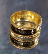 A George IV 18ct mourning ring, a 8mm wide the gold band with recessed black enamel centre with