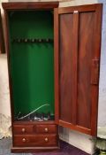 A recently commissioned flamed mahogany gun cabinet by Gardner & Bannister, cabinet makers, the