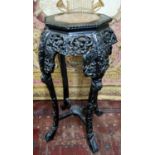 A Chinese carved hardwood jardiniere stand, octagonal marble inset panel c.1900