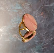 A 22ct gold and pink agate ring, set with an oval pink agate stone, 30 x 24mm, size N, 9g gross