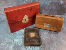 An early 20th century red morocco leather stationery case,  writing surface, stamp and paper pouches