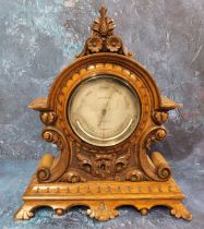 A Victorian oak mantel barometer, the 12cm silvered diam inscribed Levi & Co, London, the case