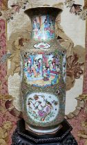 A large 19th century Cantonese Famille Rose vase, the cartouche panels decorated with figures